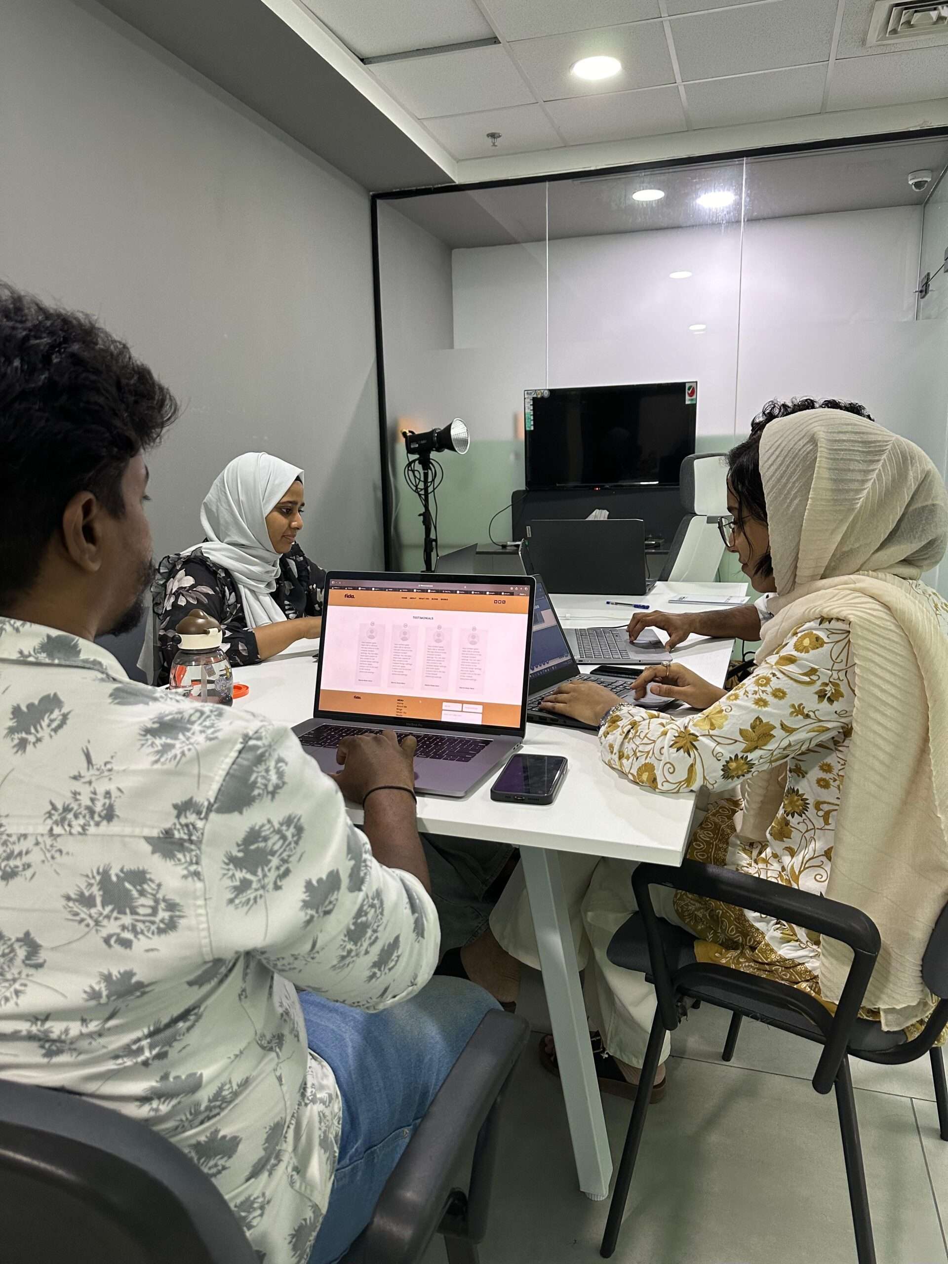 Team of colleagues collaborating and working together, highlighting the importance of having a digital marketing expert in Dubai to drive strategic growth and online success